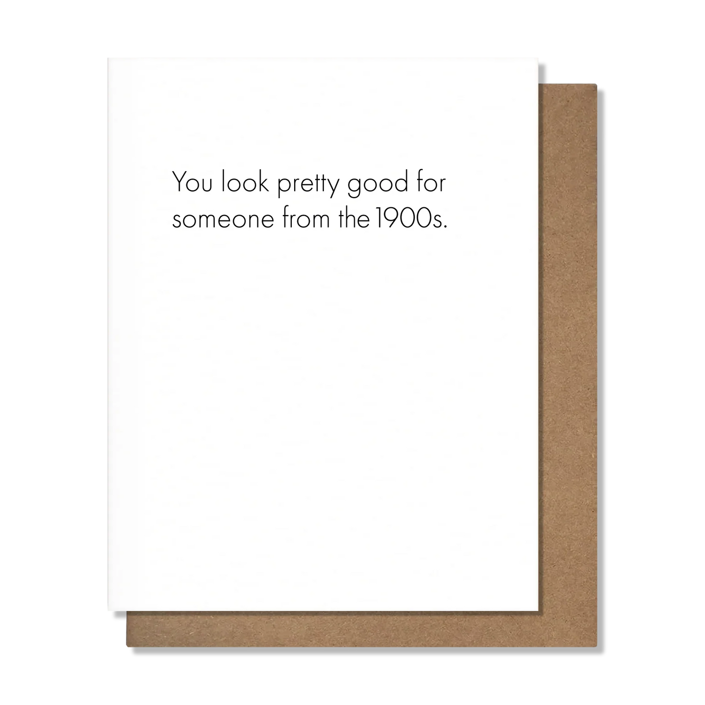 Note card with text 'You look pretty good for someone from the 1900s.' on a white background.