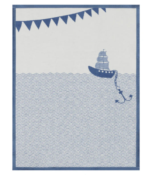 Nautical-themed baby blanket with a ship and banner design in blue and white.