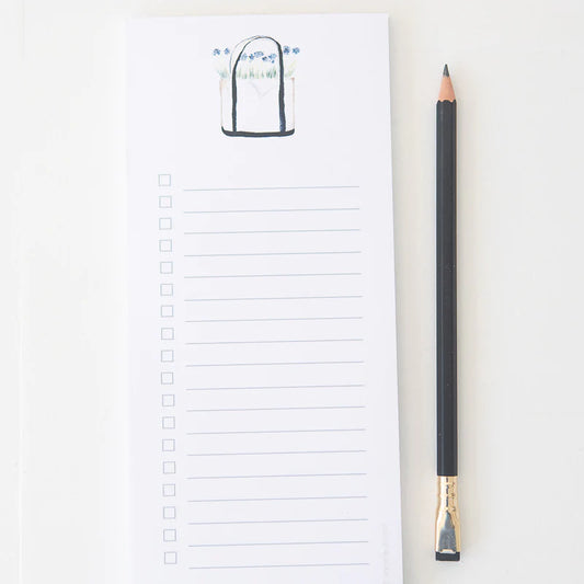 Tear away list style notepad with an image of a tote with flowers  Notepad is lined with check boxes