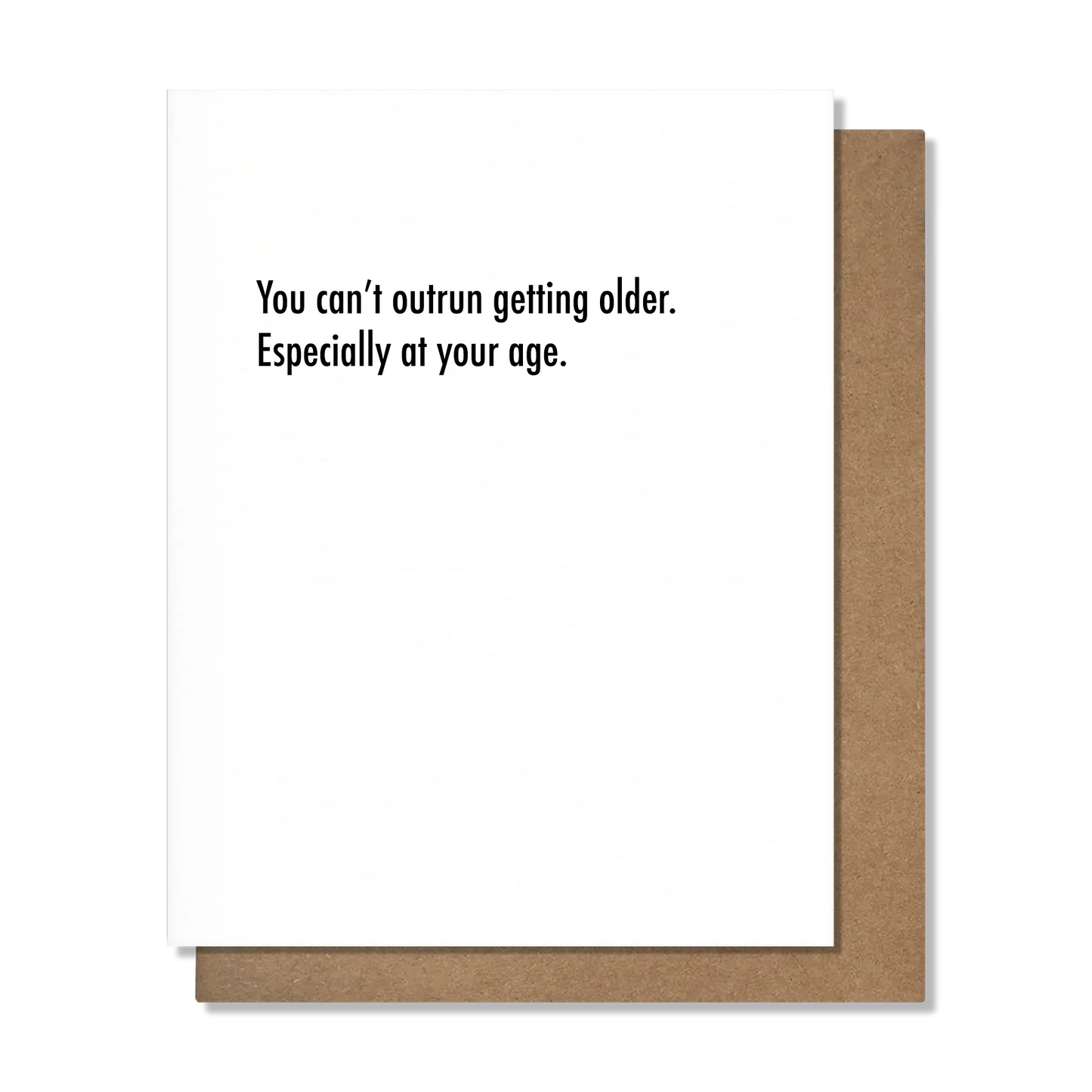 White Card with the text 'You can't outrun getting older. Especially at your age." accompanied by a kraft envelope