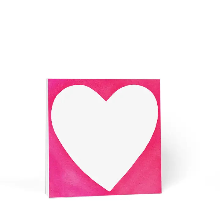 Square Magenta note pad with chubby white heart in the middle.