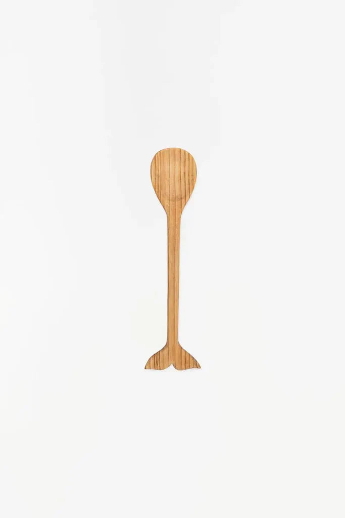 Wooden spoon with a whale tail shape at the end of the handle