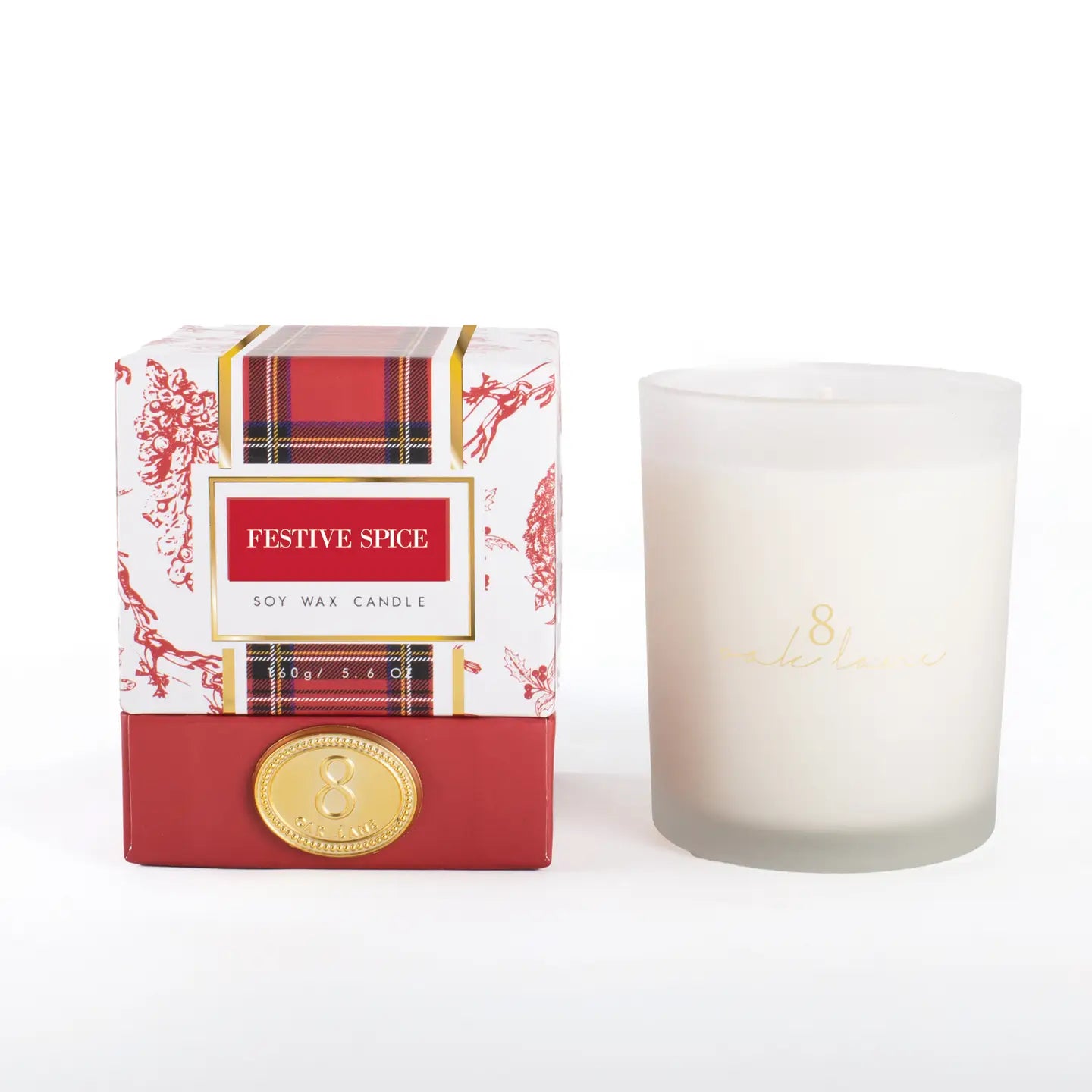 Festive spice candle with berry and tartan packaging on a white background