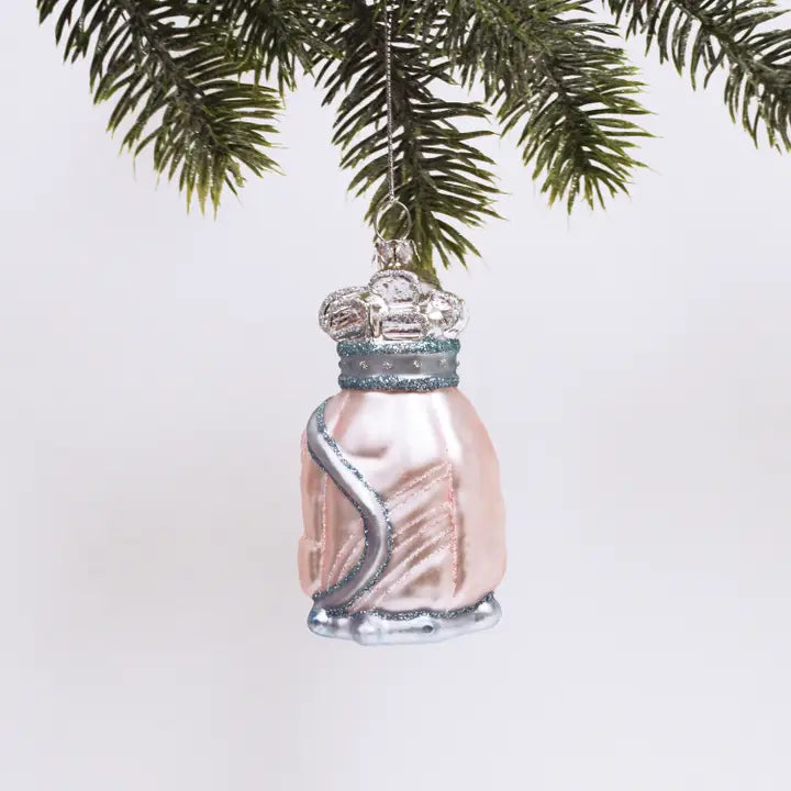 Glass golf bag Ornament that is pink and has sparkles on it