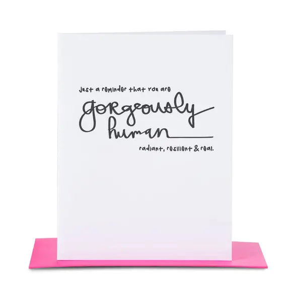 White greeting card with motivational message written in black with hot pink envelope