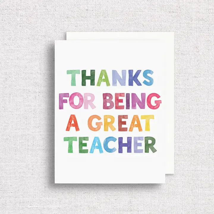 White Greeting Card with watercolor print that states 'Thanks for being a great teacher'. Print is multi-color