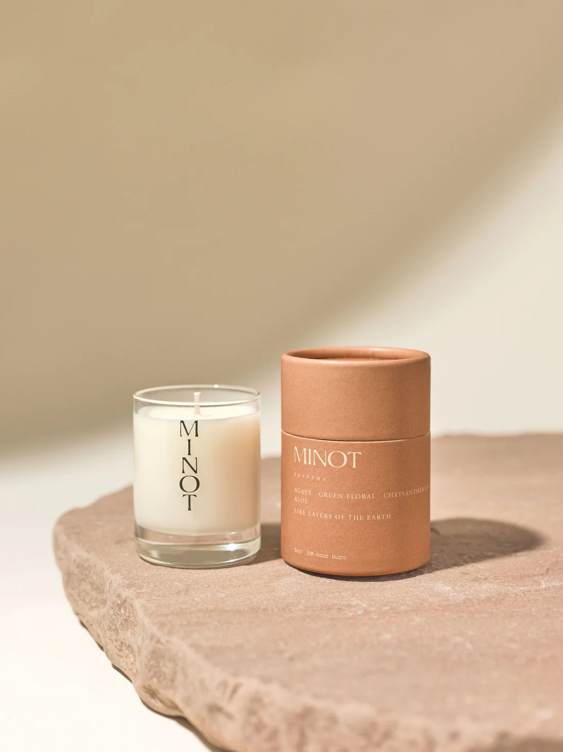 Small candle from Minot with a orange case