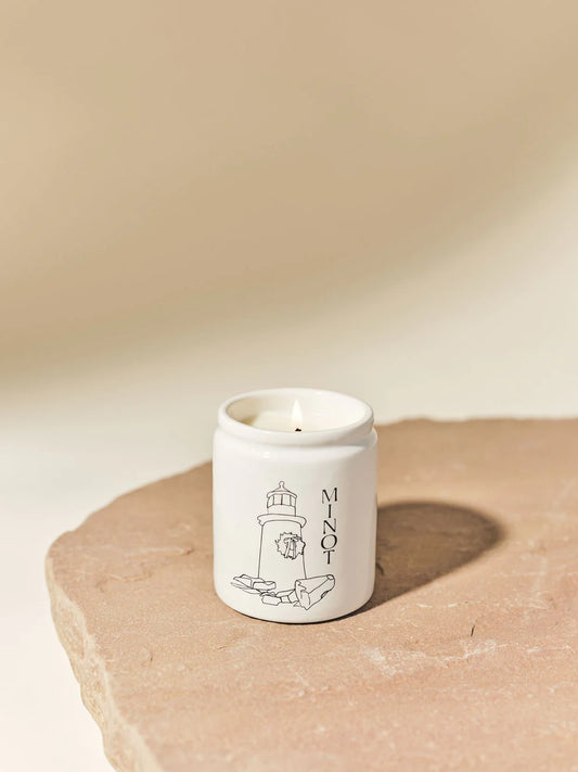Ceramic Candle with a lighthouse and a wreath  the word minot vertiical