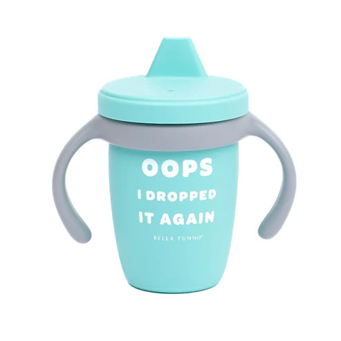 A blue baby sippy cup with the text 'OOPS I DROPPED IT AGAIN' printed on it, featuring a soft spout and two handles.