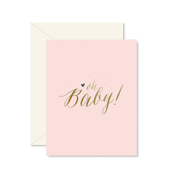 Pink baby card that has gold wors in the middle with a blue heart