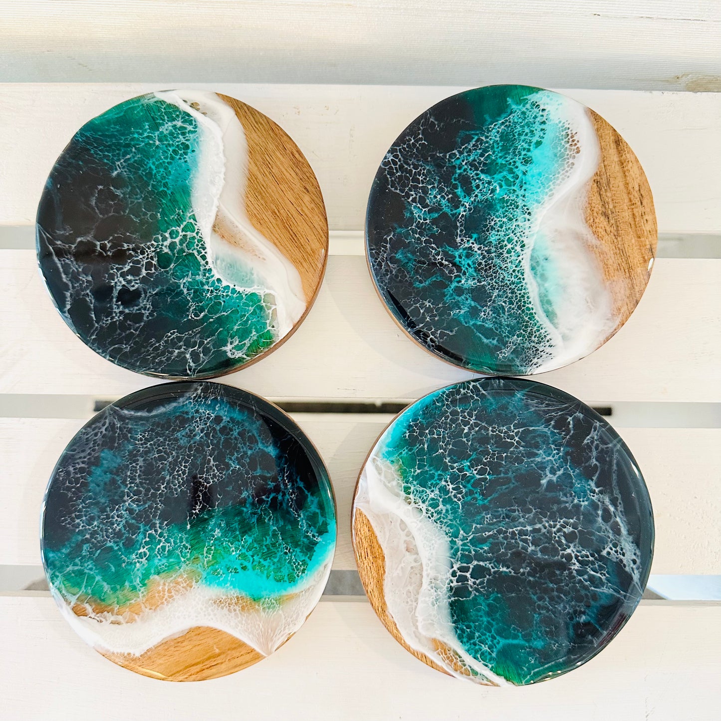 Set of 4 round wood coasters with resin ocean design