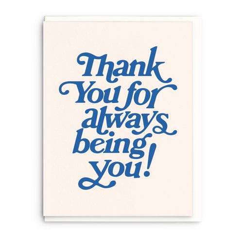 White thank you card that has big dark blue words written from top to bottom