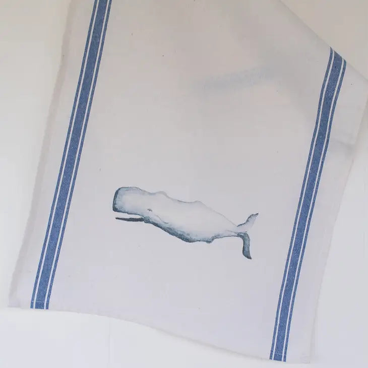 Whale tea towel. towel has blue vertical stripes on either side