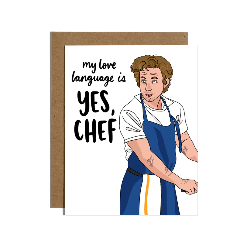 White card with a man on it that has a blue apron on and black words