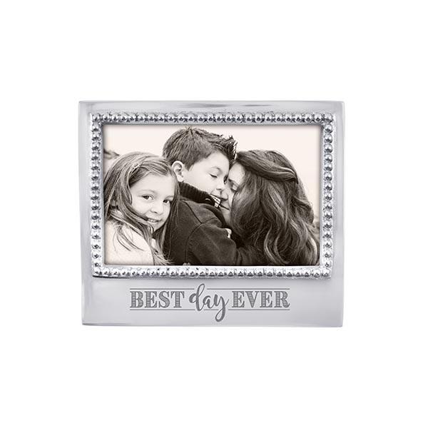 Silver horizontal frame with cursive words on the bottom and a beaded edge all around it
