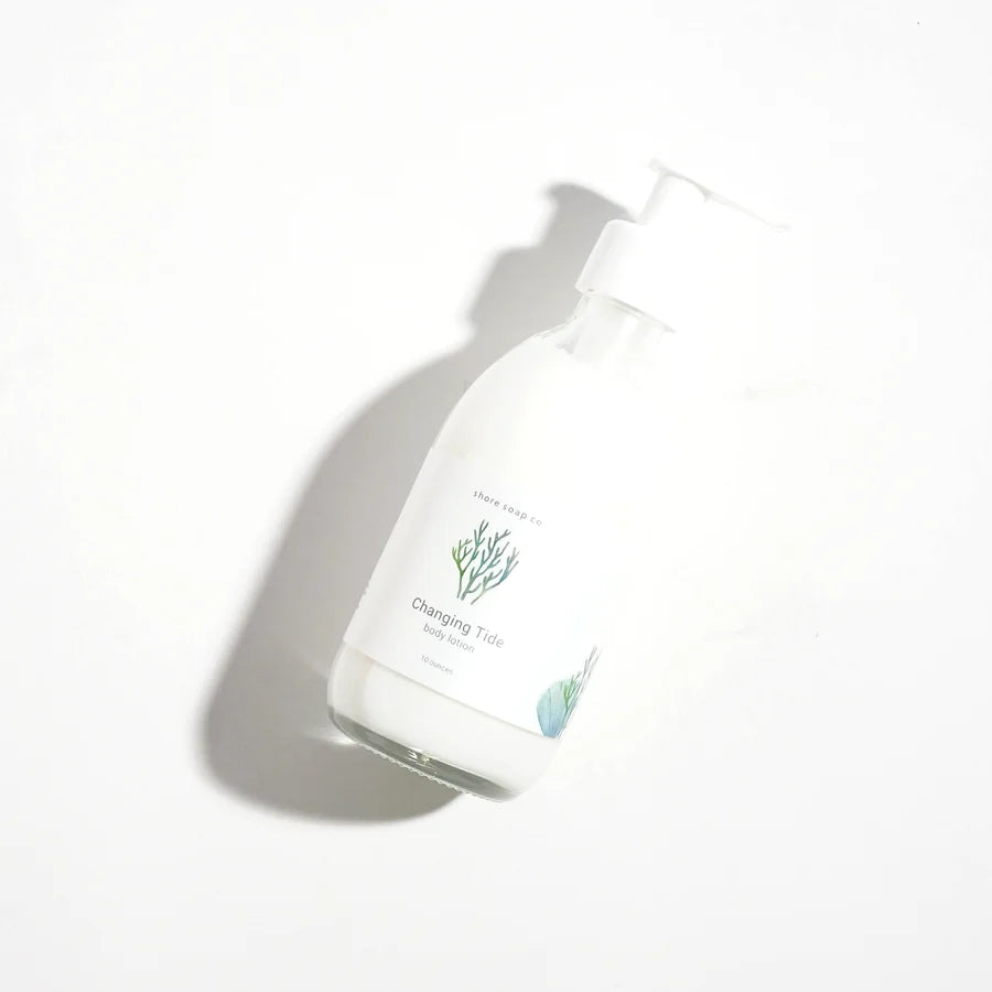 bottle of changing tide lotion lying flat