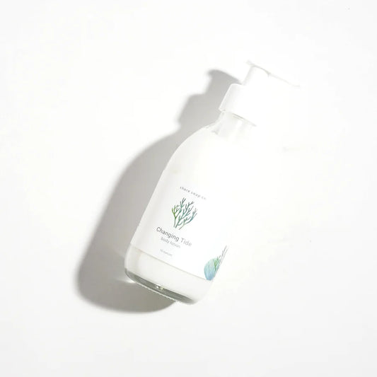 bottle of changing tide lotion lying flat