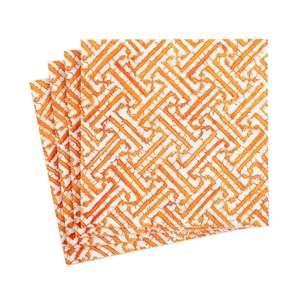 White cocktail napkin with orange fretwork design
