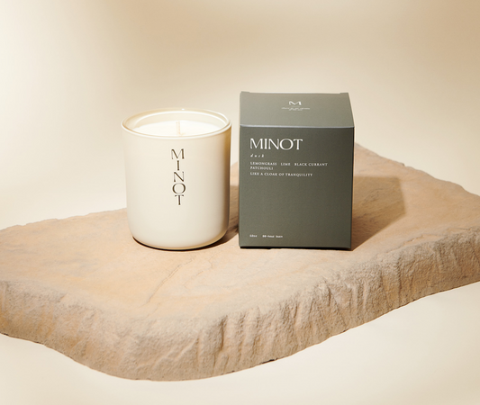 White Minot candle with a black box