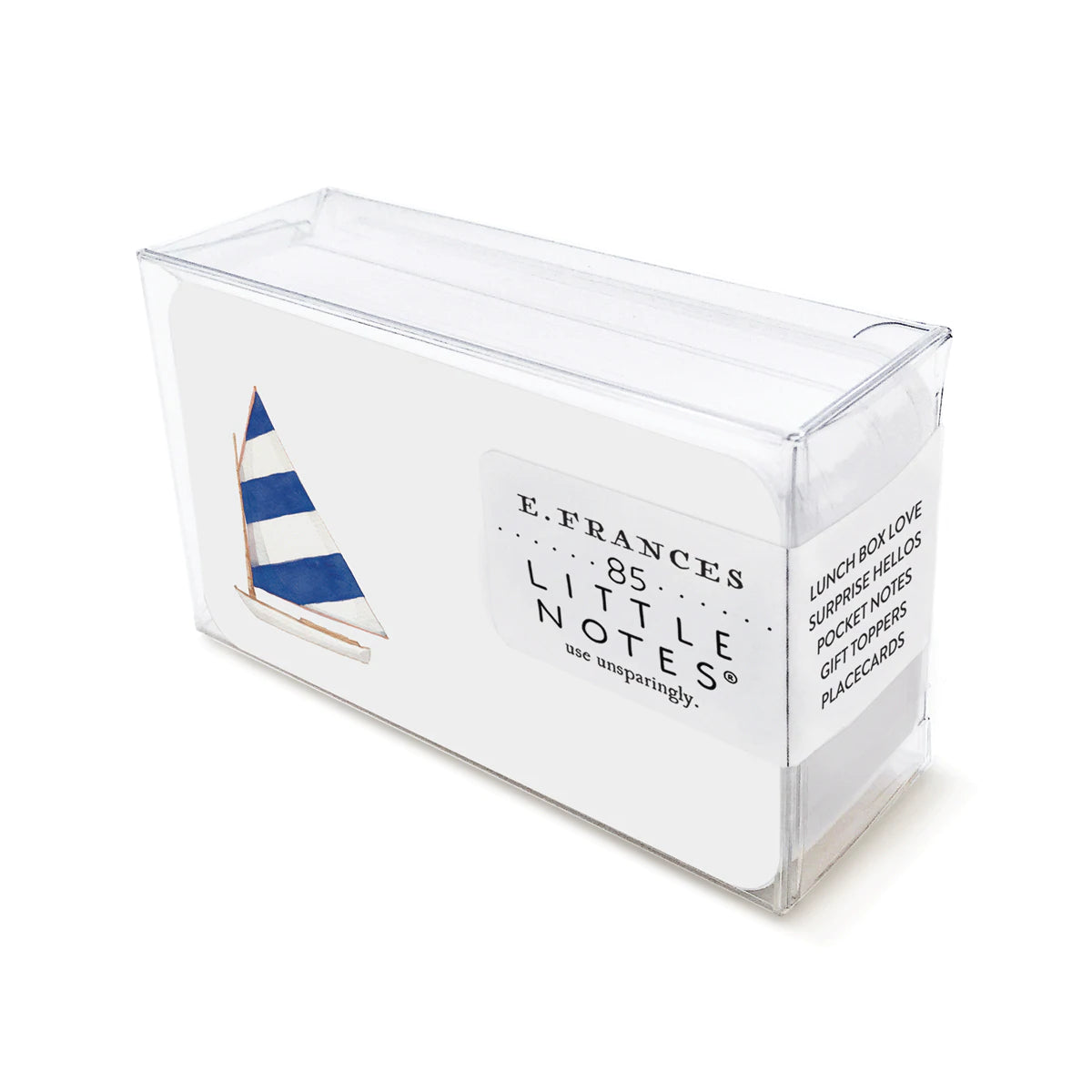 A clear plastic box containing E. FRANCES Little Notes notecards that are white with a blue and white striped sail and white sailboat
