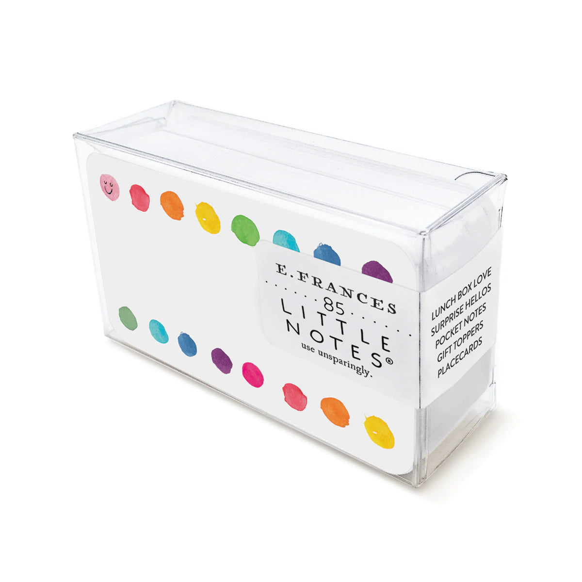 A clear plastic box containing E. FRANCES Little Notes notecards that are white with small multicolored dots at the top and bottom of the notecards
