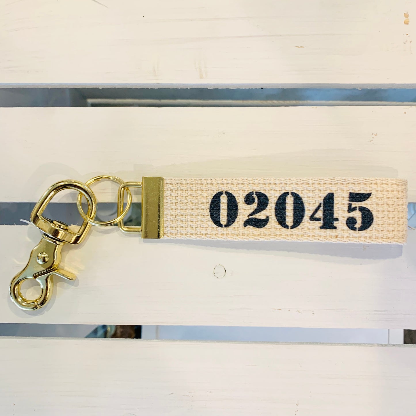 canvas key chain with zip code navy 02045 key chain with gold on it