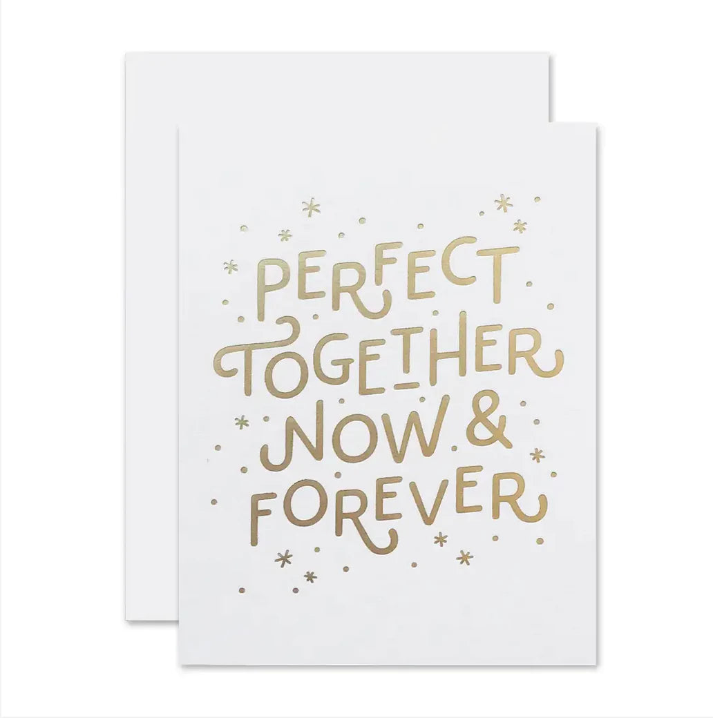 White card with gold words in the middle