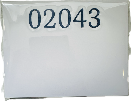 A white notepad with the zip code 02043 printed on the top in navy 
