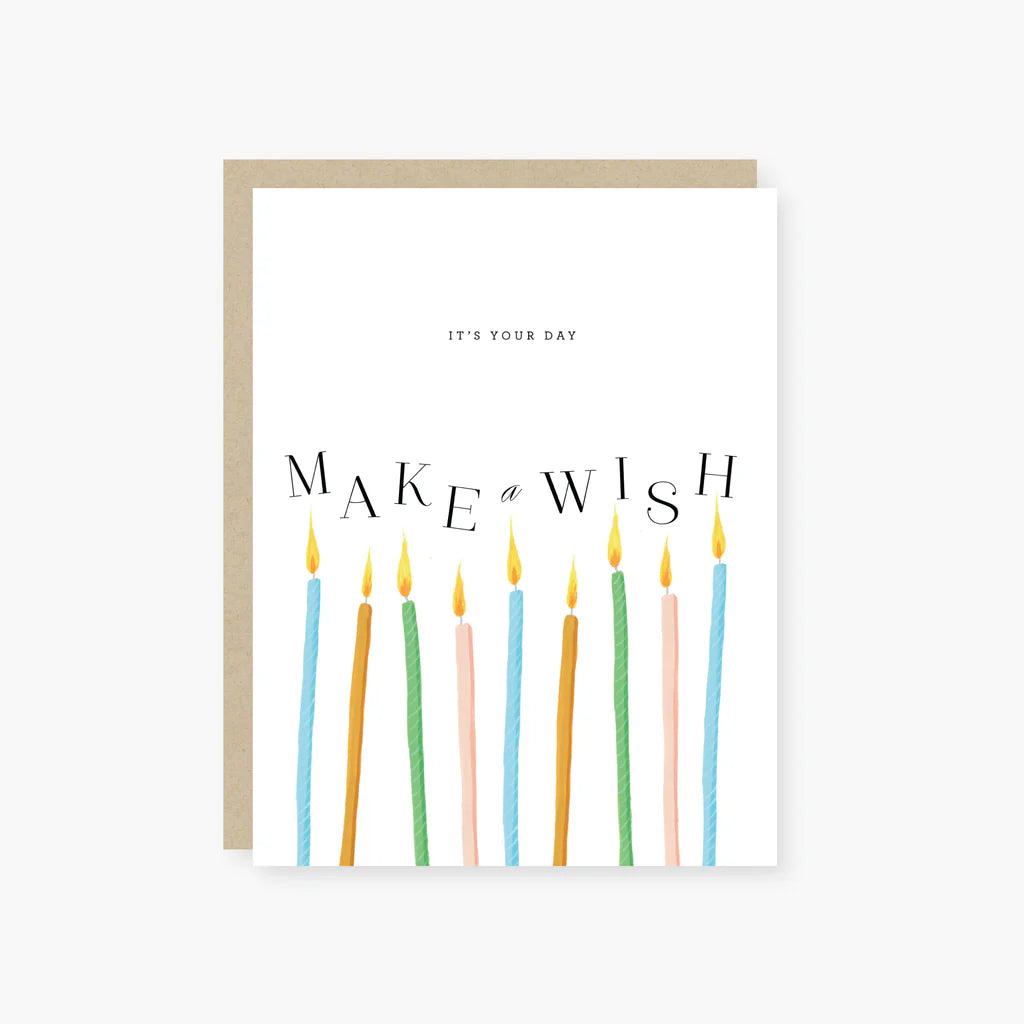 Greeting card with colorful candles and 'Make a Wish' text on a white background