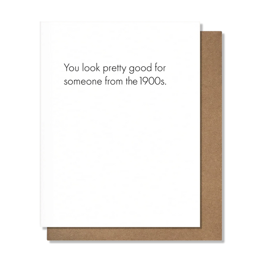 Note card with text 'You look pretty good for someone from the 1900s.' on a white background.