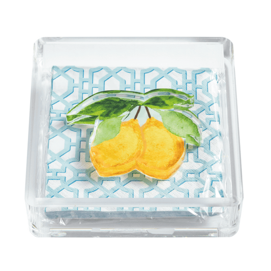 Acrylic cocktail napkin holder with geometric cocktail napkins in light blue and acrylic lemon weight