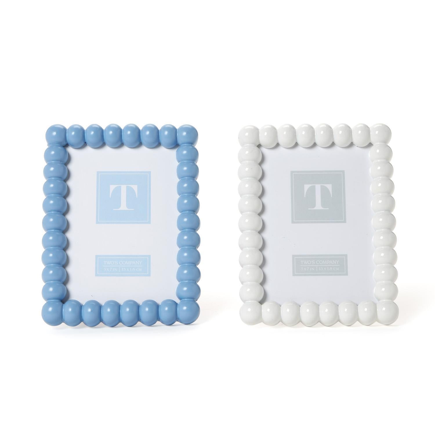 Two square picture frames with bead borders, one baby blue and one white, on a white background.