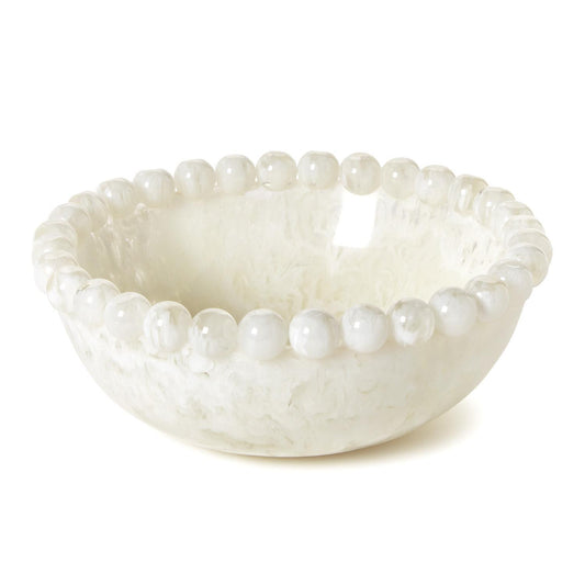 White resin bowl with pearl-like bead embellishments on a white background