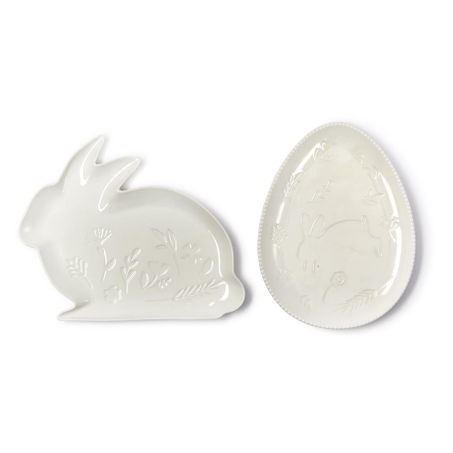 White ceramic bunny shape and egg-shaped dish on a white background