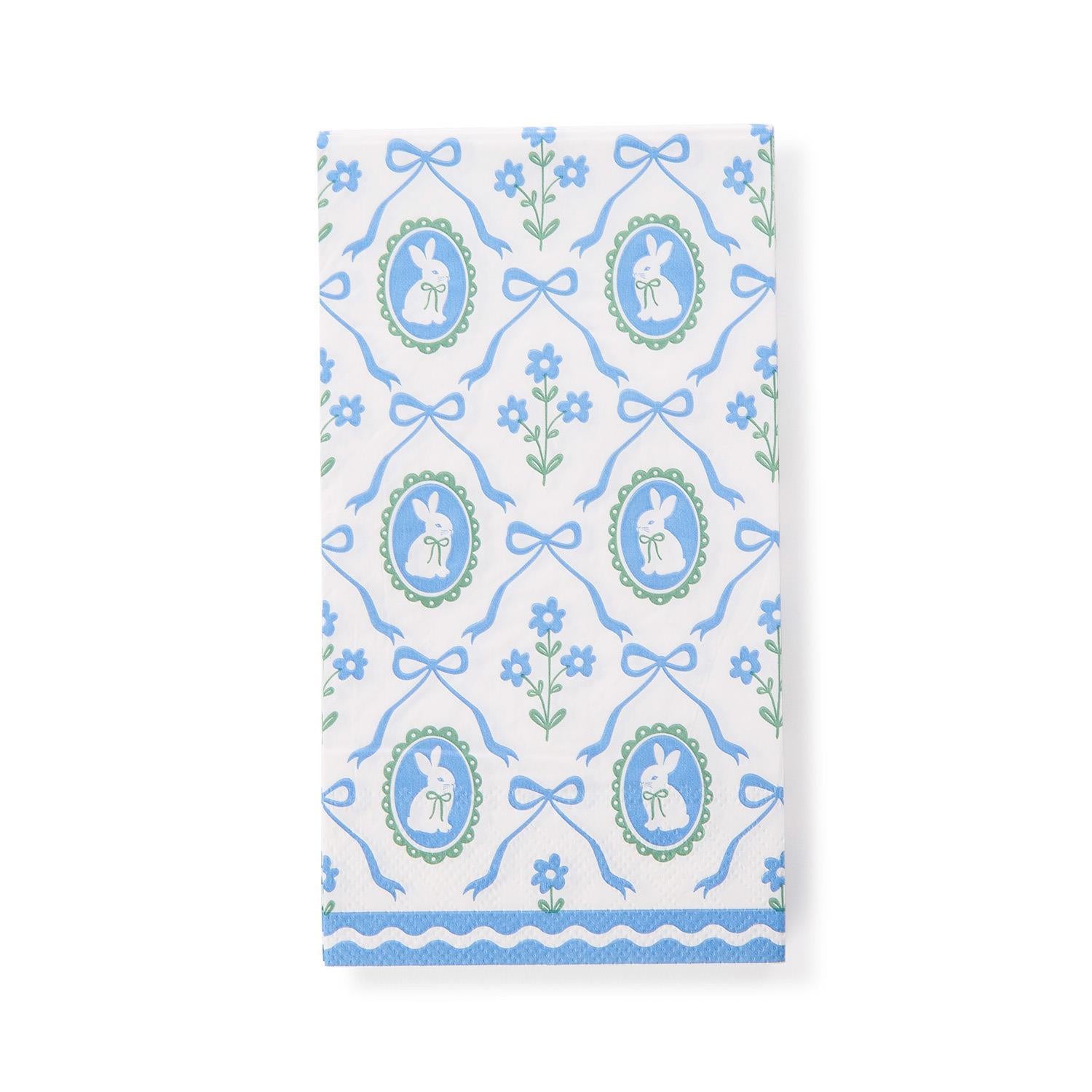 Patterned guest towel with rabbits, bows, and flowers on a white background
