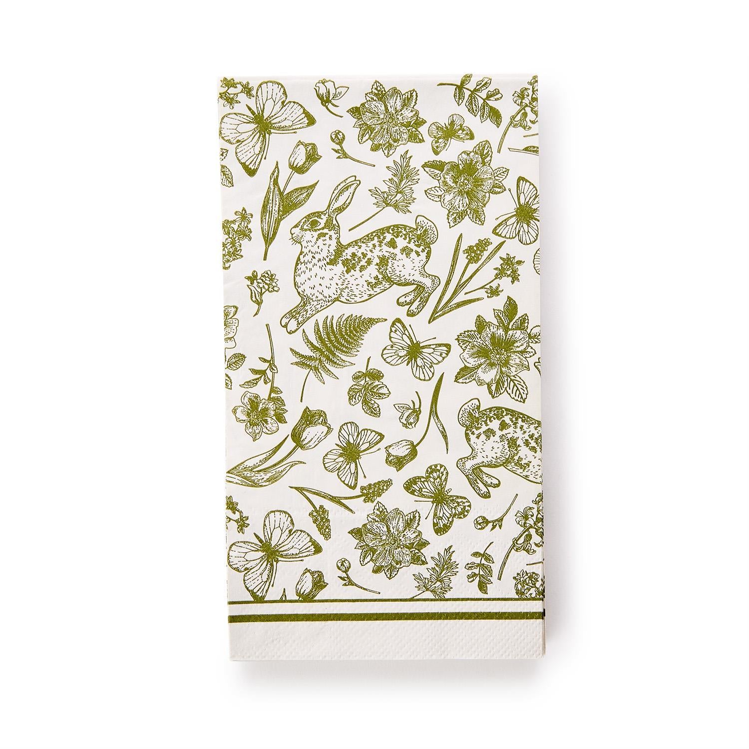 White guest towel with green floral and animal pattern on a white background