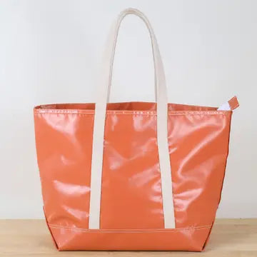 Orange-colored, water-resistant tote bag with  canvas-colored, cotton shoulder straps