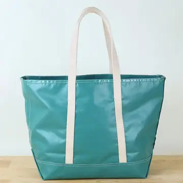 Pine green-colored, water-resistant tote bag with  canvas-colored, cotton shoulder straps