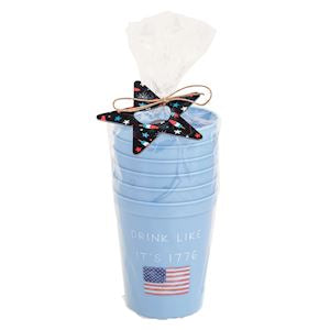 six light blue plastic party cups with "Drink like its 1776" printed on them in a clear cello bag tied with navy blue metal  star shaped bottle opener and twine