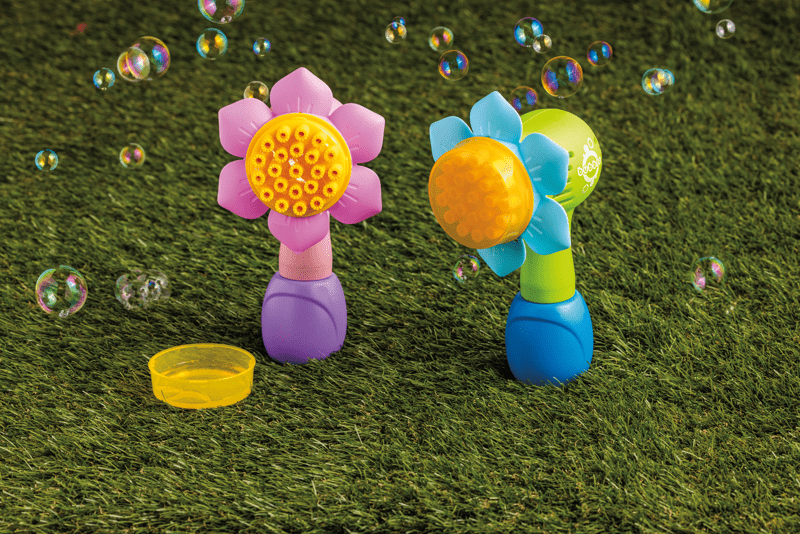 Flower shaped bubble makers in pink or blue with yellow center