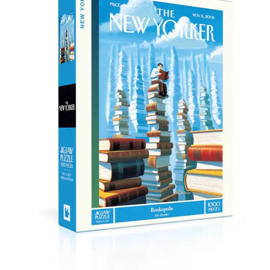 Puzzle box featuring 'The New Yorker' magazine cover with a stack of books and a person on top.