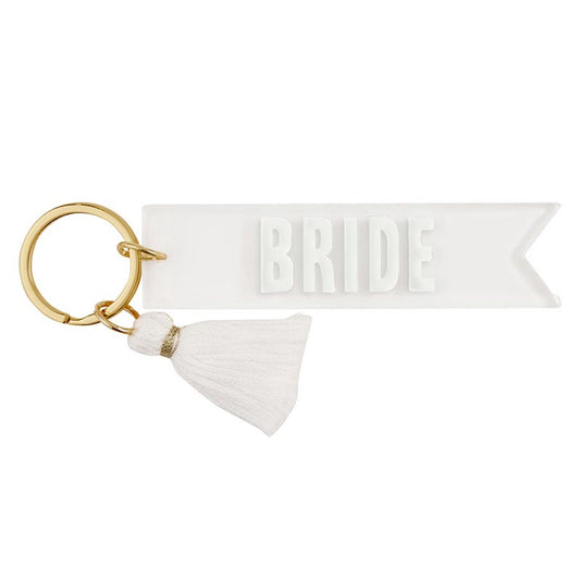white acrylic keychain with BRIDE.  Small white tassel around gold key ring 
