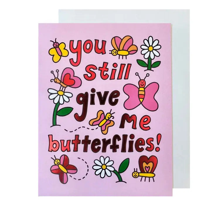Greeting card with colorful butterflies and flowers on a pink background.  States "You still give me butterflies"