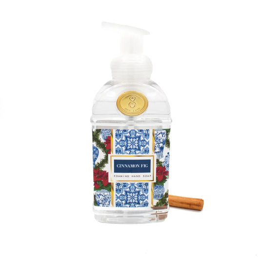 Foaming hand soap bottle with Toile and Poinsettia decorative label on a white background