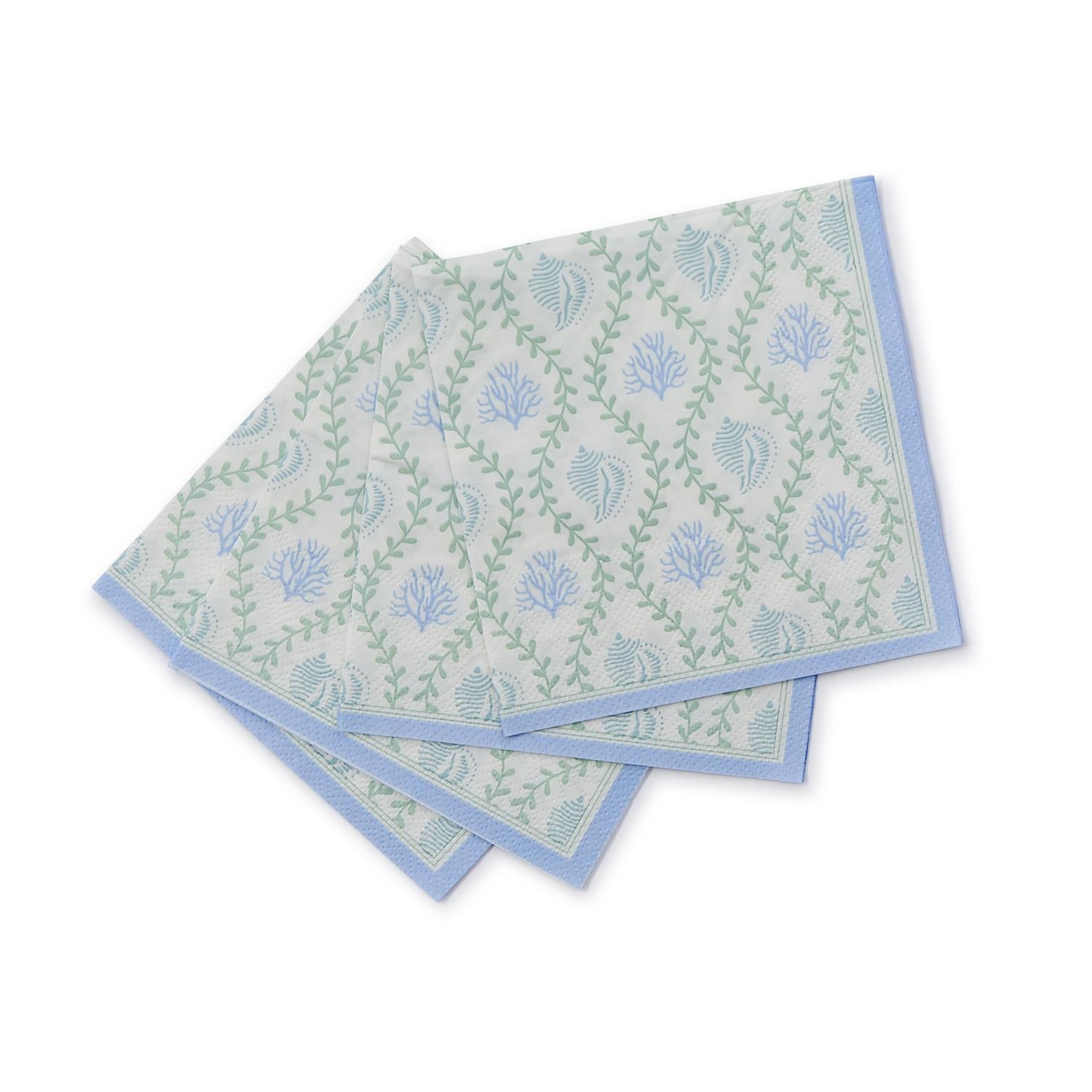 White cocktail napkin with blue decorations and beach symbols with green touches.
