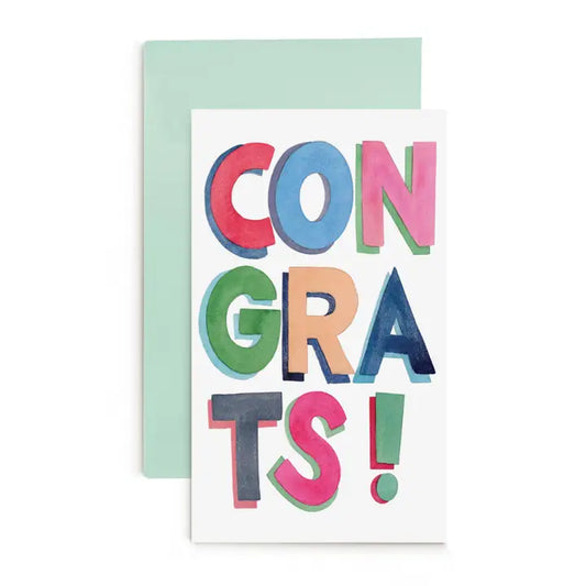 White congrats card with colorful writing that says "Congrats".
