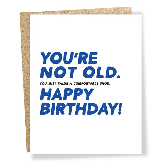 Birthday card with blue text that reads ' You're not old.  You just value a comfortable shoe.  Happy Birthday.