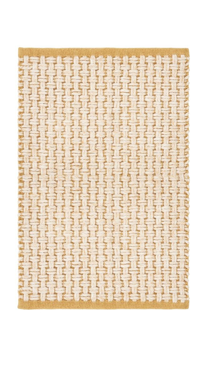 Natural fiber woven doormat in white and yellow basketweave design