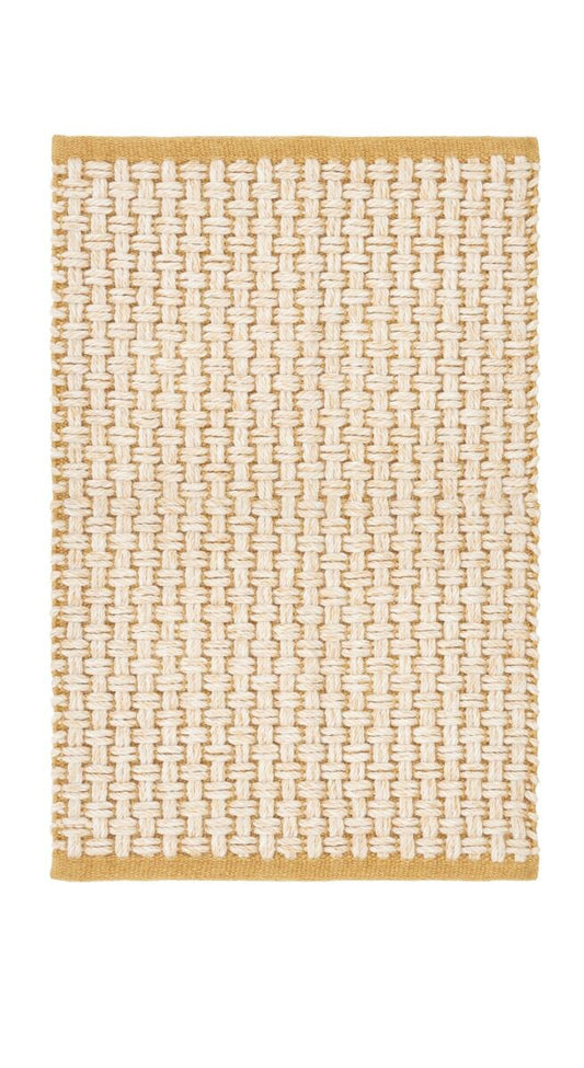 Natural fiber woven doormat in white and yellow basketweave design