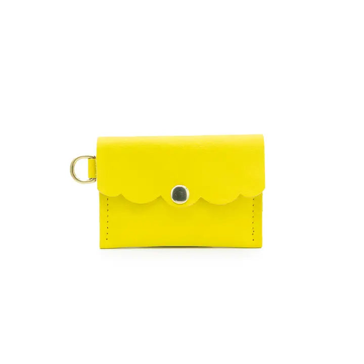 yellow mini wallet with scalloped flap, snap closure and side brass loop